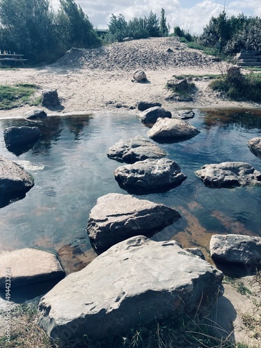Photography stepping stones form a path across a river