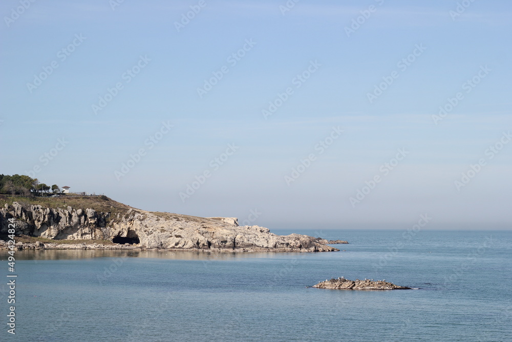 rocks on the sea close up landscape with blue sky