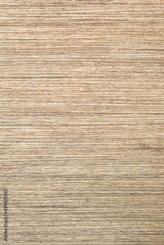 Brown texture of natural wood with a natural pattern, arranged vertically with horizontal parallel lines. Background for design