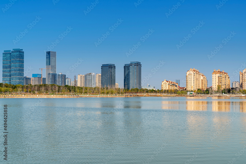 Naklejka premium Lakeside modern office building in China