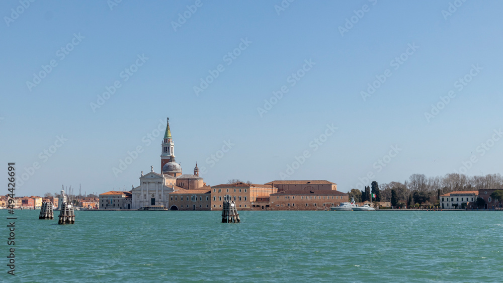 Fototapeta premium Canals, bridges and buildings in the city of Venice Italy. classic buildings, blue water canals.
