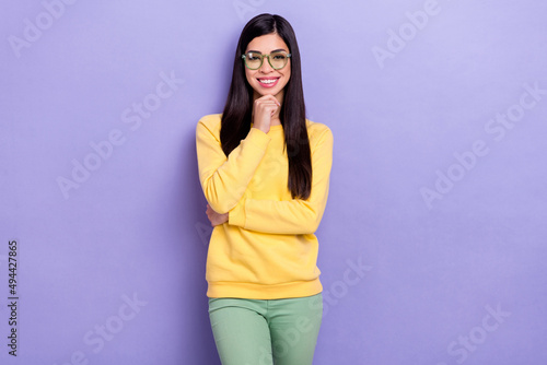 Photo of young lovely girl hand touch chin agent manager representative isolated over purple color background