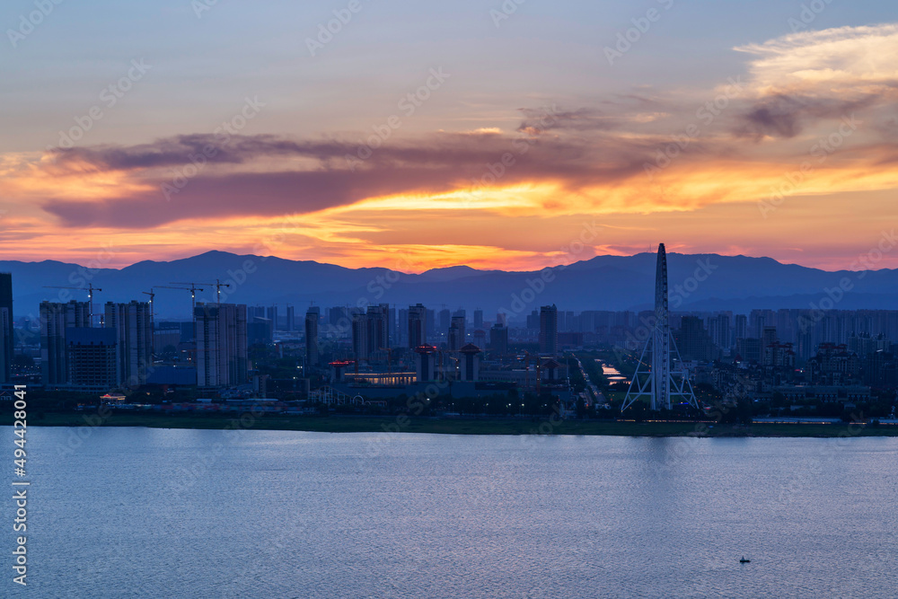 Naklejka premium sunset over the city in China