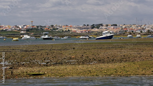 Wallpaper Mural Anchored and grounded boats among the mudflats-Ria Formosa lagoon. Faro-Portugal-137 Torontodigital.ca