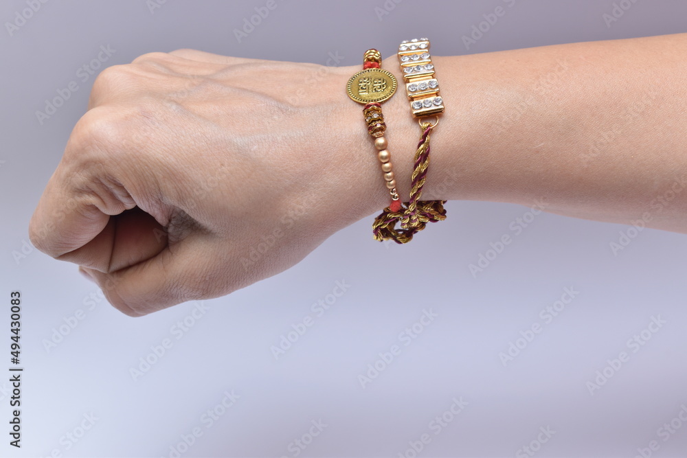 View of an Indian man's hand wearing rakhi on raksha bandhan day. Rakhi ...