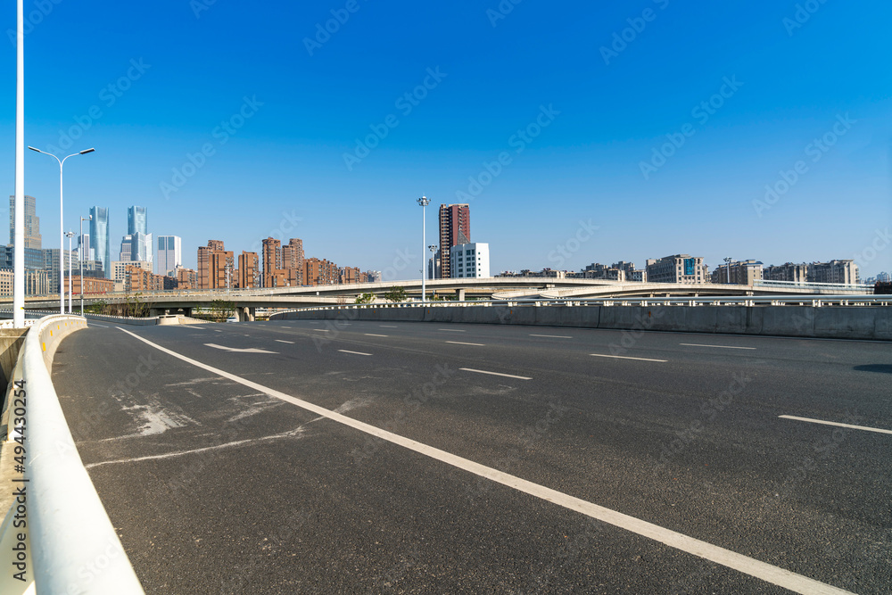 Highway overpass modern city skyline background