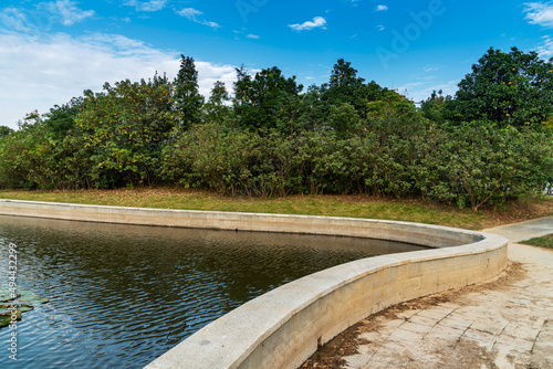 Wallpaper Mural Lush greener around the pond in the park Torontodigital.ca