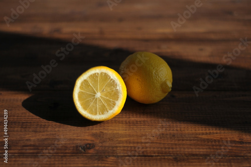 Sliced lemon lying on a wooden table