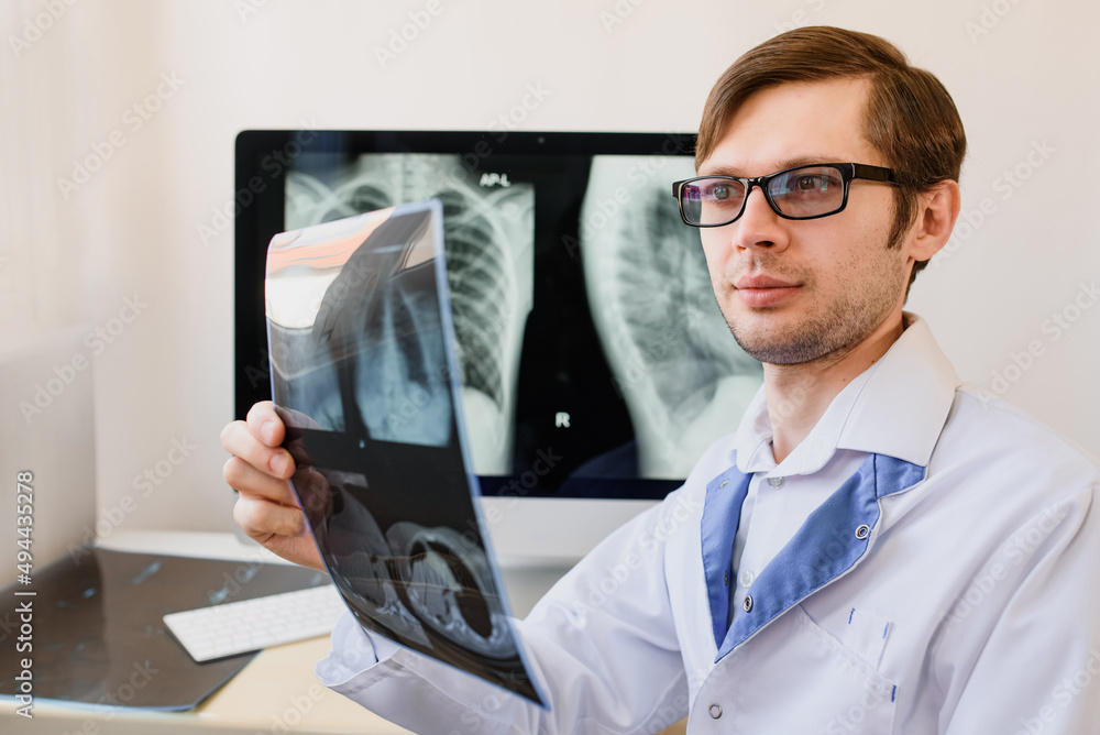 Radiologist analyzing a chest x-ray with pneumonia in right hemithorax lung. Radiologist analyzing a chest x-ray with pneumonia in right hemithorax lung.