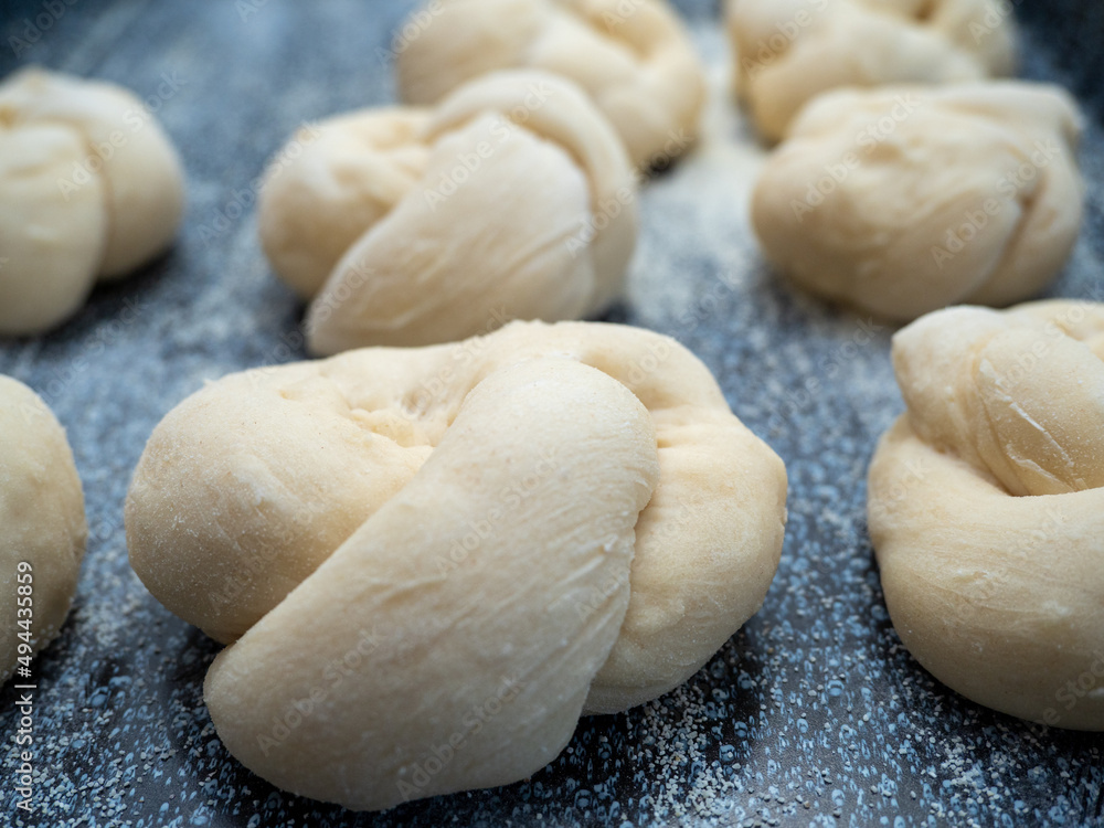 the process of making buns. Raw dough.