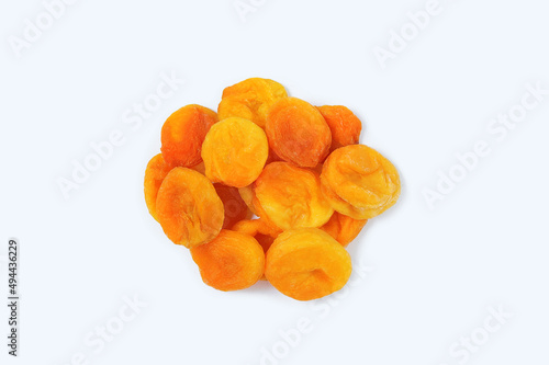 Dried apricots bunch on white background close-up.