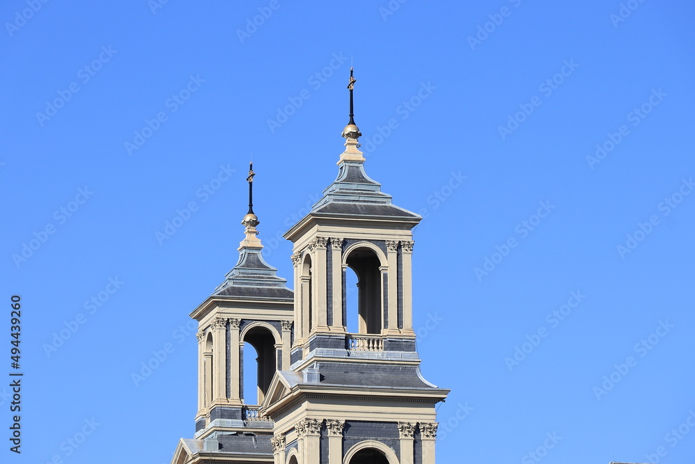 Amsterdam Mozes en Aaaronkerk Church Towers Against a Blue Sky Close Up, Netherlands