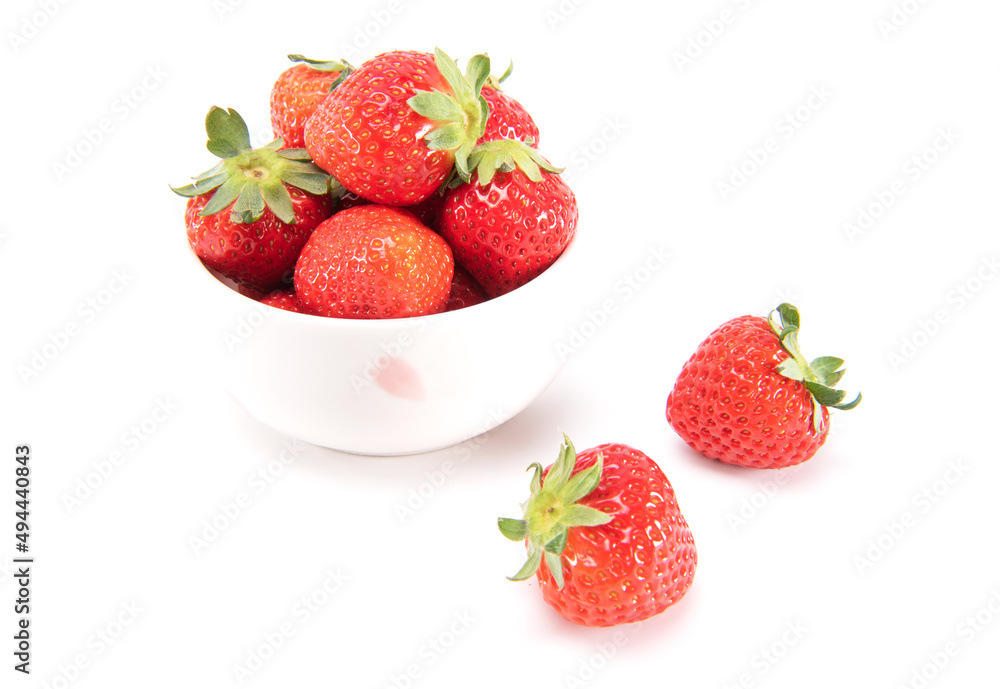 Fresh ripe strawberries in ceramic bowl and on white background. japanese fruit. Selective focus Fresh ripe strawberries in ceramic bowl and on white background. japanese fruit. Selective focus