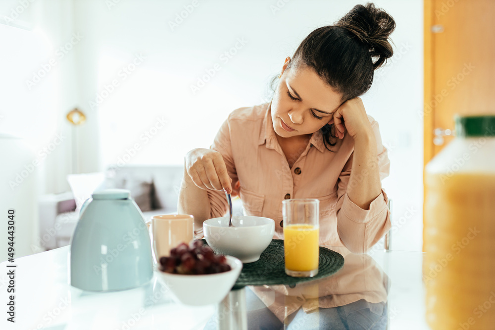 Portrait of woman with lack of appetite during meal. Appetite loss concept