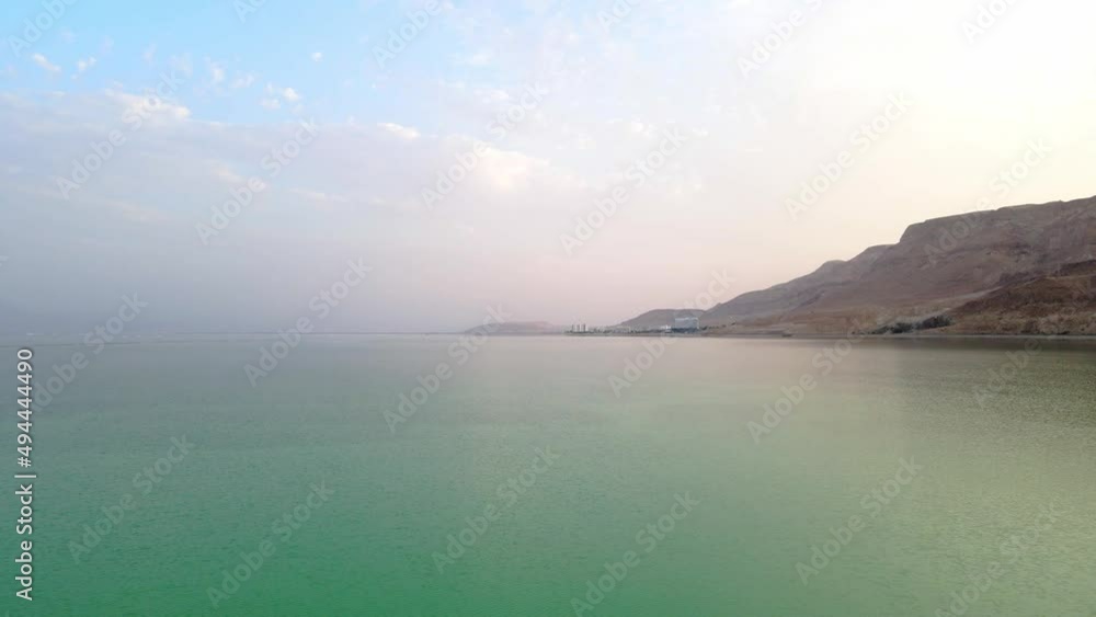 Dead Sea. Soaring aerial view above the Dead Sea. Natural landscape. Dead seas Hills near the sea. Desert. Hills near the dead sea. Natural Background.