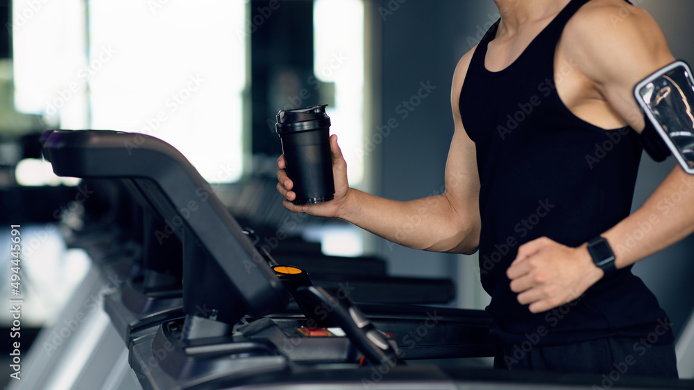 Sporty Lifestyle. Unrecognizable Male Athlete Jogging On Treadmill At Modern Gym Sporty Lifestyle. Unrecognizable Male Athlete Jogging On Treadmill At Modern Gym