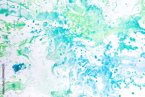 watercolor spots of green and blue on a white background. texture. bright spots and splashes of paint on the paper.