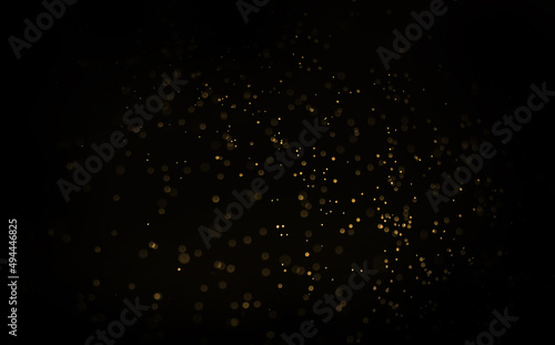 Abstract golden bokeh on black background Christmas party day