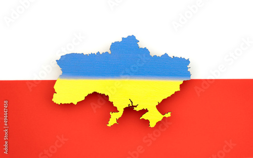Ukraine on background of Polish flag. Blue-yellow country map. Concept of solidarity