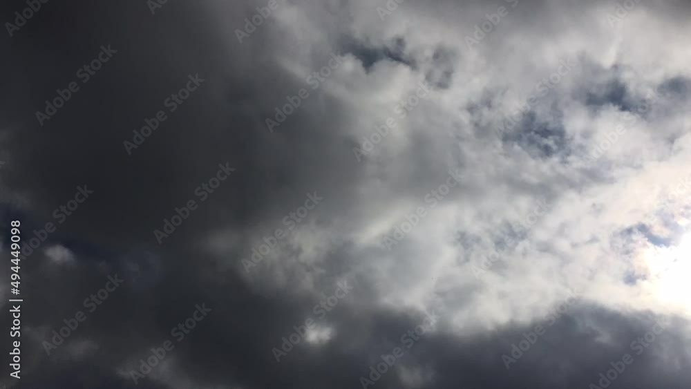 Gray clouds move quickly across the sky. The entire sky is covered with blue-gray cumulus clouds, from which it can rain at any moment. Clouds move quickly as they go, changing shape and size. Gray clouds move quickly across the sky. The entire sky is covered with blue-gray cumulus clouds, from which it can rain at any moment. Clouds move quickly as they go, changing shape and size.