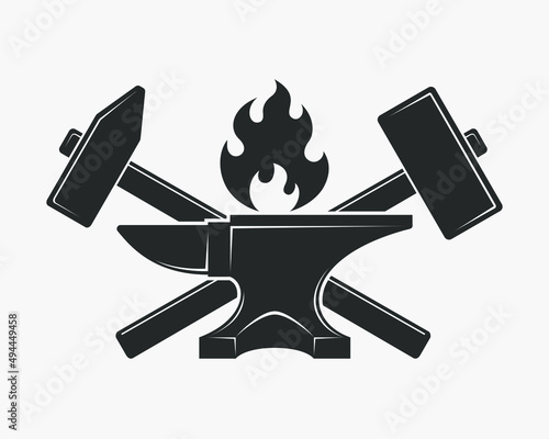 Blacksmith shop graphic label. Forge symbol with forging tools including hammers, anvil and fire. Vector illustration photo