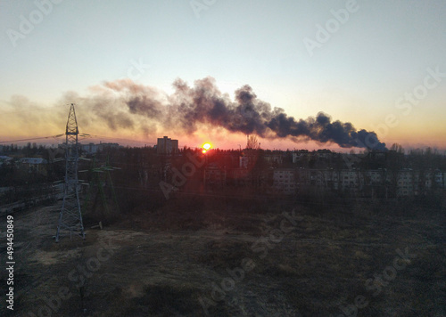 Canvas Print A civilian residential building in Kyiv, Ukraine, burns and smokes heavily after being bombed by Russian missiles during the war and the Russian attack on Ukraine