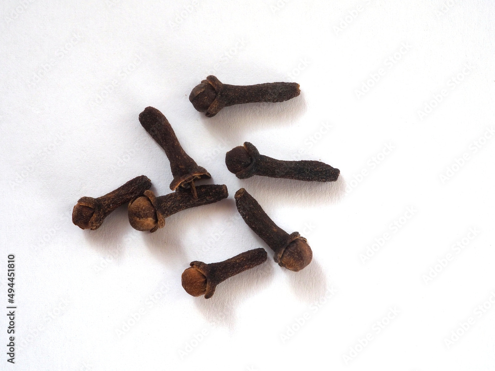 Cloves (spice). Dried buds of tropical clove tree (Syzygium aromaticum) Flat lay Cloves (spice). Dried buds of tropical clove tree (Syzygium aromaticum) Flat lay