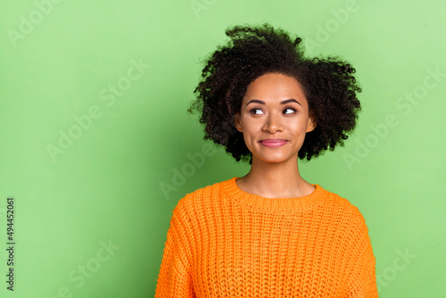Photo of nice millennial volume hairdo lady look promotin wear orange pullover isolated on green color background © deagreez