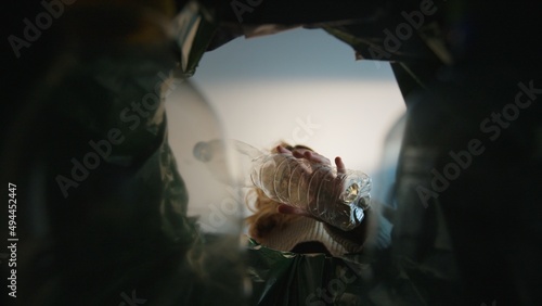 Εκτύπωση καμβά Woman putting empty plastic bottle in recycling bin in the kitchen