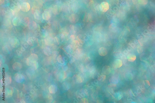 Abstract defocused blue background with shining glitter.Good as overlay layer.Abstract defocused background with shining glitter.