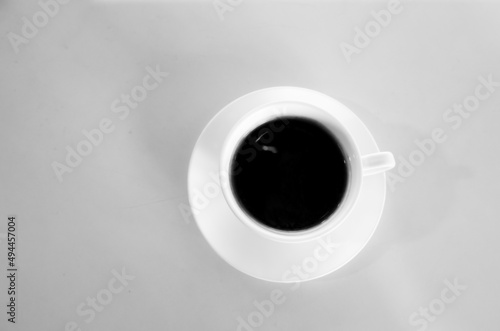black coffee on a white table photo in the early morning