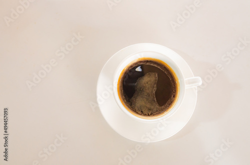 black coffee on a white table photo in the early morning