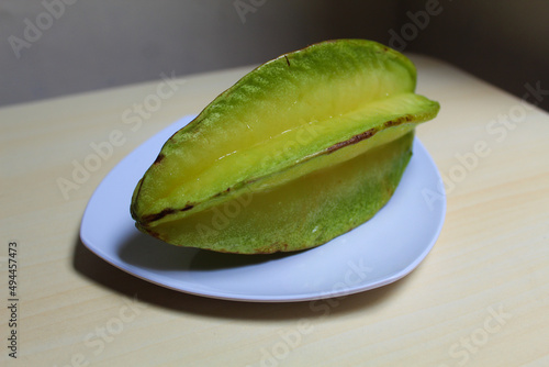 Carambola, or star fruit or 5 fingers, is the fruit of Averrhoa carambola. Green-yellow color.