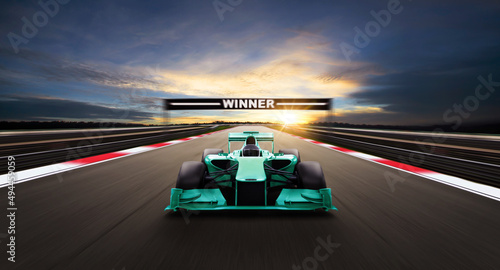 Race car racing on speed track, Car race on asphalt road race track crossing winning board with motion blur background. 3D Rendering.