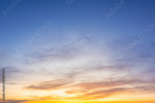 Beautiful Vivid sky painted by the sun leaving bright golden shades.Dense clouds in twilight sky in winter evening.Image of cloud sky on evening time.Evening Vivid sky with clouds.