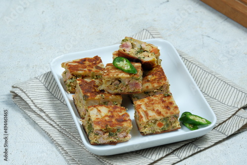 Martabak Telor or Martabak (muttabaq ) Telur. Savory pan-fried pastry stuffed with egg, meat ,vegetable and spices photo