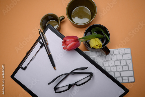 clipboard pen coffe cup reading glasses inventory concept.On a coffee break