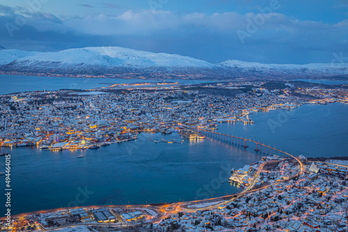 Aerial view of beautiful winter landscape of snow covered town Tromso