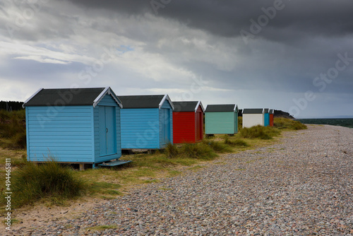 Leinwand Poster Beautiful shot of colorful plastic huts at Findhorn beach, Moray, Scotland