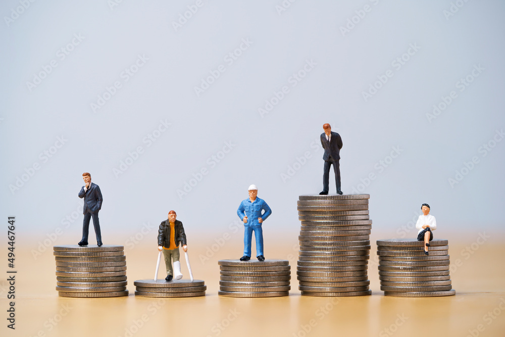 Five Miniature figure in each career standing to different high and low coins stacking for variation of income or salary in each job concept. Five Miniature figure in each career standing to different high and low coins stacking for variation of income or salary in each job concept.