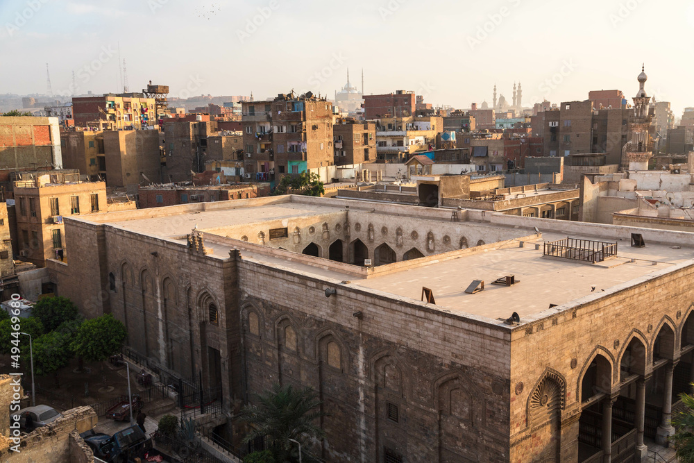Cairo, Egypt - January 2022: View over Al-Salih Tala'i Mosque and the city from Bob Zuweila at sunset