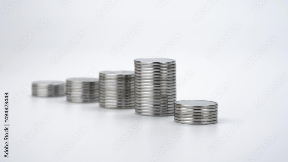 Raising Stacks of Coins on White Background. Coins Appear One By One. Money Saving and Trade Concept. Stop Motion Animation Raising Stacks of Coins on White Background. Coins Appear One By One. Money Saving and Trade Concept. Stop Motion Animation