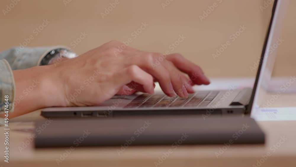 Close up of Asian male hands with short nails who is typing at the keyboard. Working from home due to Covid-19 situation is productive. Laptop is the smart device that could work and convenience. Close up of Asian male hands with short nails who is typing at the keyboard. Working from home due to Covid-19 situation is productive. Laptop is the smart device that could work and convenience.