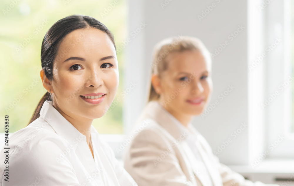 Team of professional support staff working in the office. Colleagues in the workplace solve customer problems. Call center and customer support concept. Team of professional support staff working in the office. Colleagues in the workplace solve customer problems. Call center and customer support concept.