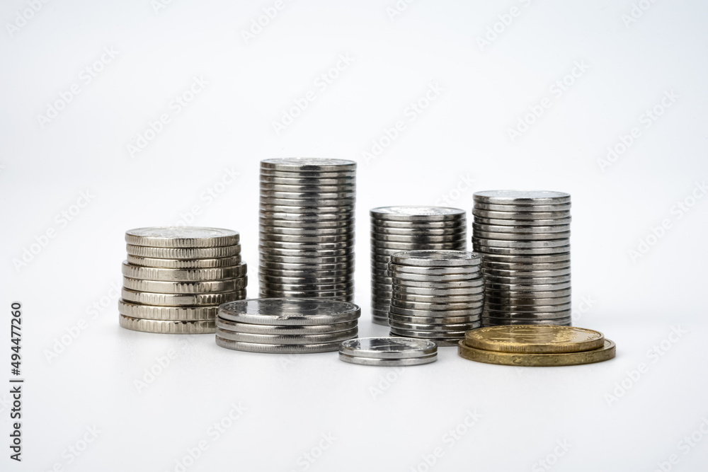 Stacks with Coins on White Background. Money Saving and Economy Concept Stacks with Coins on White Background. Money Saving and Economy Concept