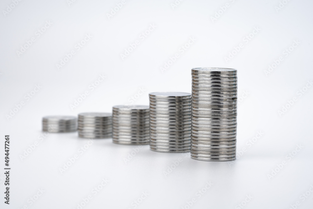 Stacks with Coins on White Background. Money Saving and Economy Concept Stacks with Coins on White Background. Money Saving and Economy Concept