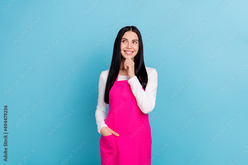 Photo of young sweet brunette lady hand face look promo wear white cloth pink apron isolated on blue color background Photo of young sweet brunette lady hand face look promo wear white cloth pink apron isolated on blue color background