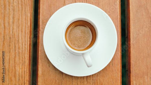 cup of coffee on wooden table