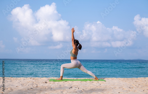 Young woman practicing yoga in the nature .Yoga is meditation and healthy sport concept