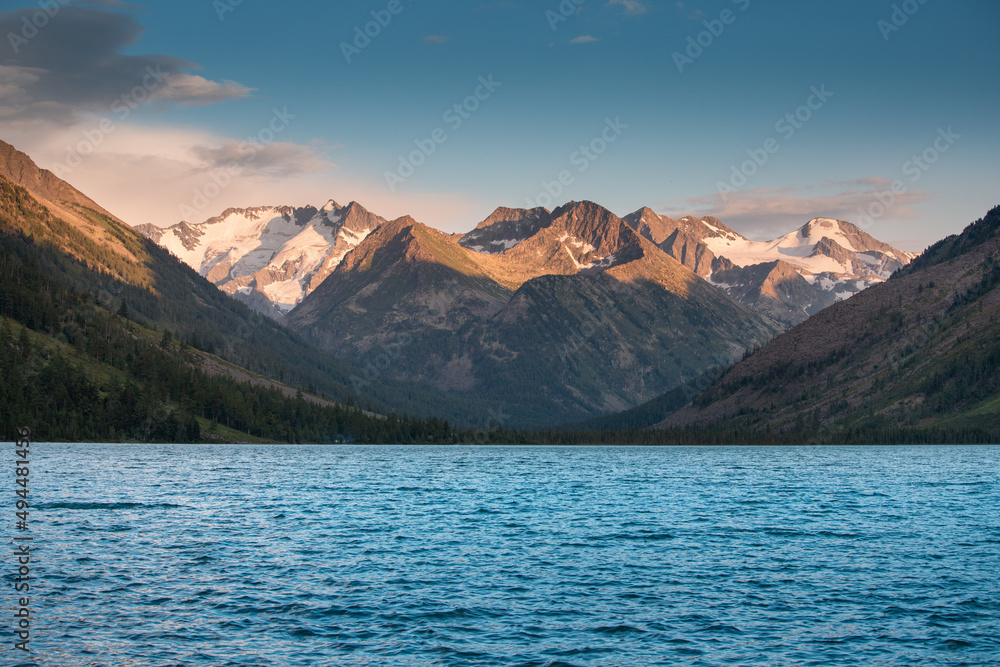 A beautiful and inspiring landscape with an idyllic mountain lake during a colorful sunset in the wilderness
